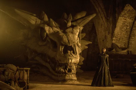 HD desktop wallpaper featuring Lena Headey as Cersei Lannister standing beside the skull of Balerion from the TV show Game of Thrones.