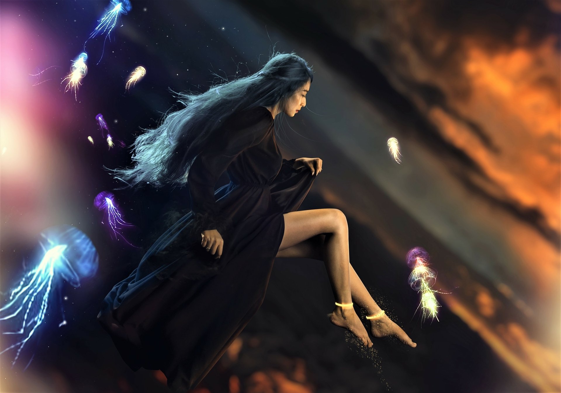 Asian fantasy mage woman in flowing dark robe floats among glowing jellyfish spirits against a stormy sky — 2K Quad HD PC desktop wallpaper/background.