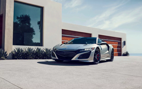 Silver Acura NSX supercar parked in front of a modern house, captured in 4K Ultra HD as a sleek PC desktop wallpaper and background.