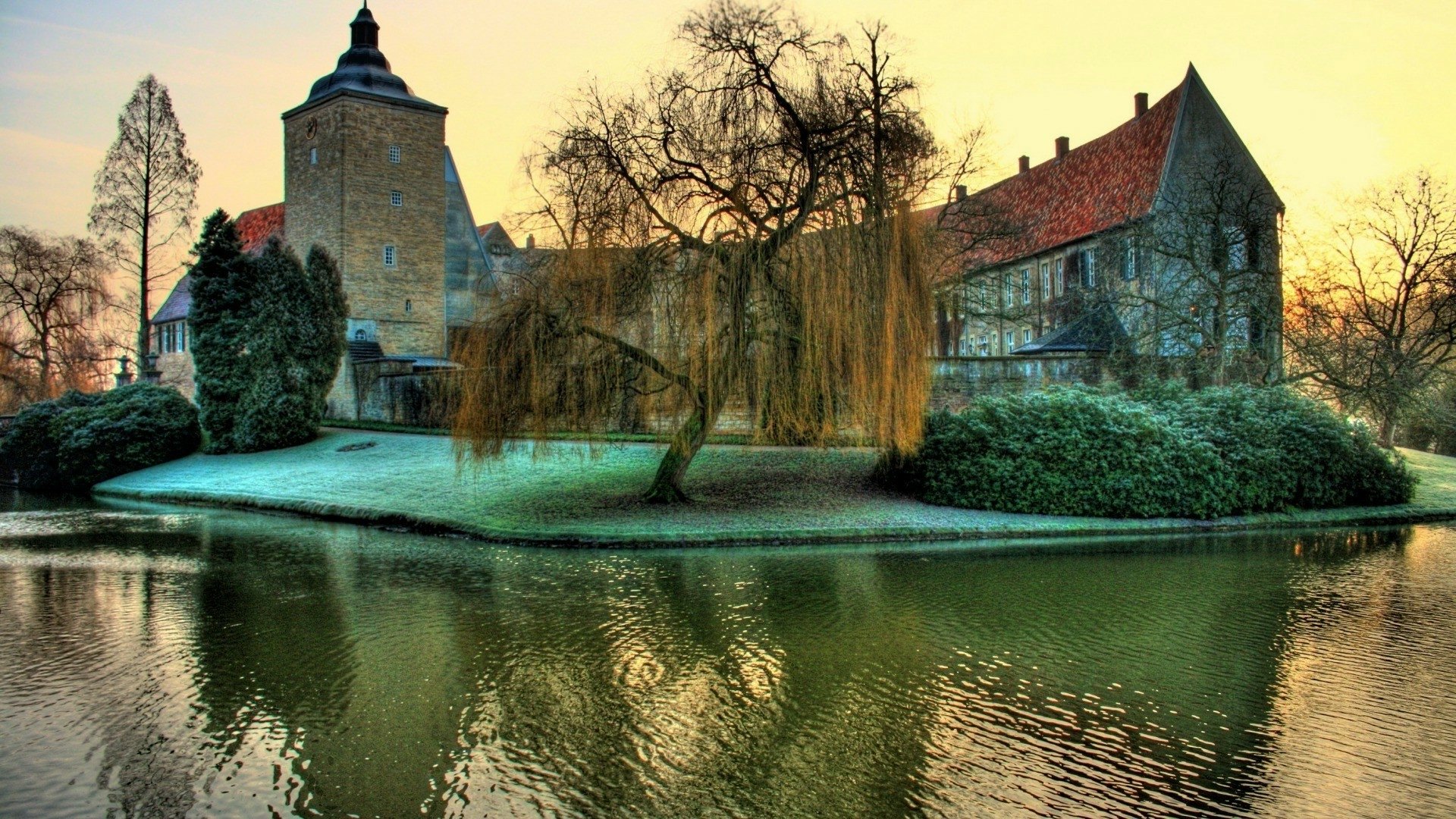 HDR image of a historic church and tree by a lake in Germany during fall, captured as an HD PC desktop wallpaper background.