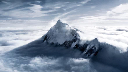 HD desktop wallpaper of Mount Everest rising above clouds under a dramatic sky, showcasing the majestic mountain and natural beauty.