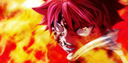 HD PC desktop wallpaper featuring Natsu Dragneel from the anime Fairy Tail, with intense flames and a determined expression.