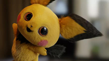A high-definition desktop wallpaper featuring Pichu from Pokémon Detective Pikachu, showcasing its adorable expression and vibrant colors.