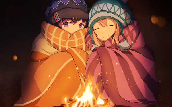 Rin Shima and Nadeshiko Kagamihara from Laid-Back Camp share a warm moment by a campfire, wrapped in cozy scarves and blankets in this HD anime desktop wallpaper.