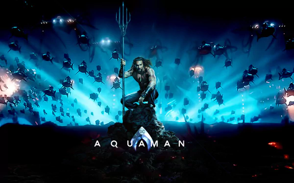 HD PC desktop wallpaper featuring Jason Momoa as Aquaman, standing with his trident amidst an underwater scene filled with glowing aquatic creatures.