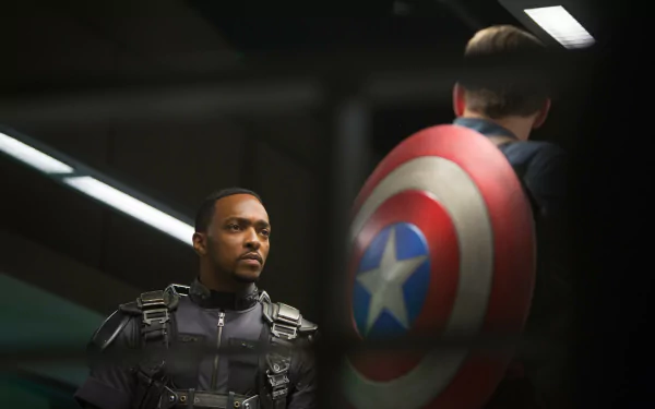 Falcon stands in tactical gear alongside Captain America with his iconic shield in this 4K Ultra HD wallpaper from the movie Captain America: The Winter Soldier.