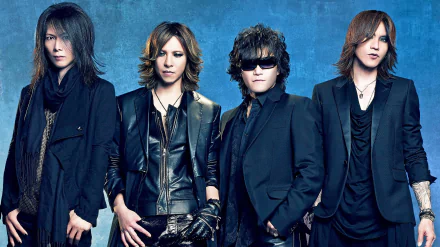 A striking HD desktop wallpaper featuring the iconic Japanese rock band X Japan, showcasing the members in stylish black outfits against a textured blue background.