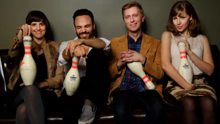 HD desktop wallpaper featuring the members of Lake Street Dive posing with bowling pins, suitable as a background.