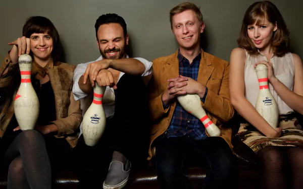 HD desktop wallpaper featuring the members of Lake Street Dive posing with bowling pins, suitable as a background.