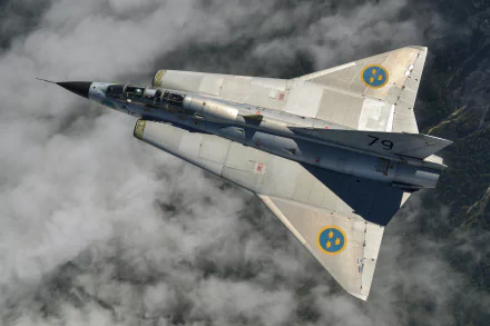 Saab 35 Draken jet fighter warplane with Swedish roundels, soaring above clouds in a 4K Ultra HD military aircraft desktop wallpaper.