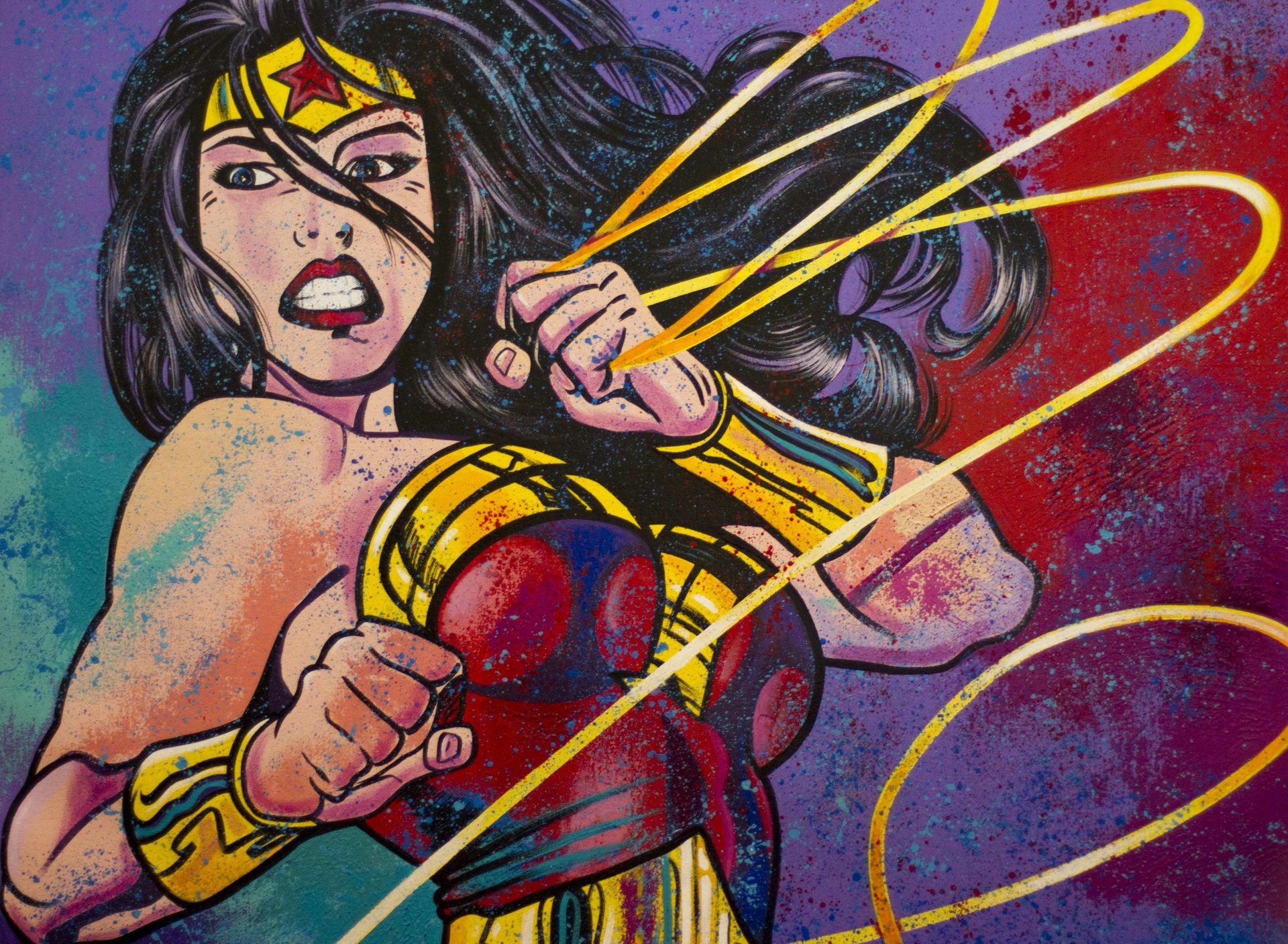 4K Ultra HD DC Comics wallpaper featuring Wonder Woman in dynamic action, wielding her iconic lasso against a vibrant, textured background.