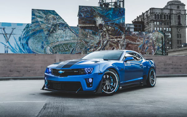 A blue Chevrolet Camaro ZL1 sports car parked in an urban setting, showcased as a 4K Ultra HD PC desktop wallpaper and background.
